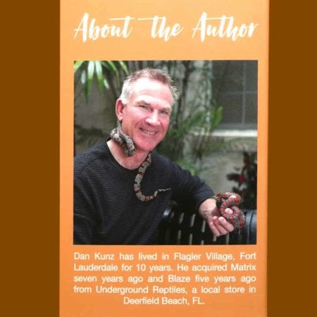 Man holding a colorful snake, reptile expert at Underground Reptiles store.