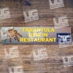 Tarantula tank label with "Reserved for 8 Legs" sign.